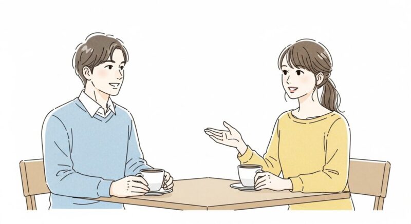 テーブル越しに会話する日本人カップル、穏やかな雰囲気の中で笑顔が交わる様子